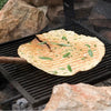 Pane Rustico flatbread grilling over fire