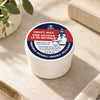 Fox Run Craft Wax, 2 oz, in its original white jar on a warm stone surface.