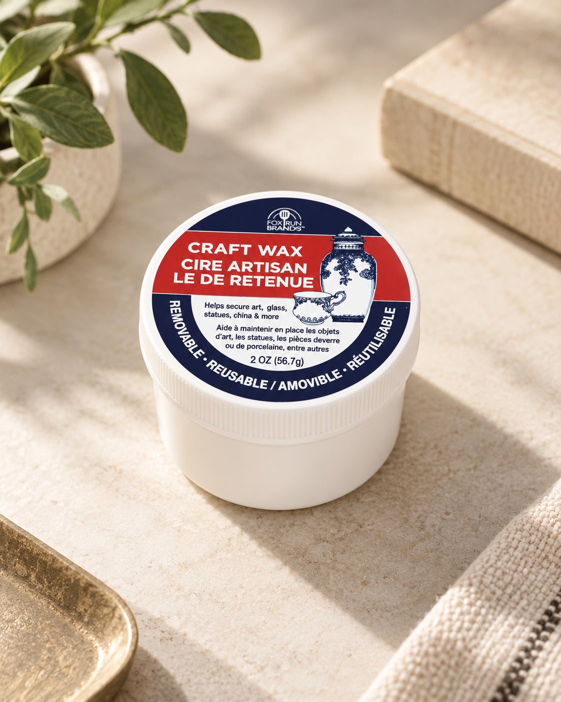 Fox Run Craft Wax, 2 oz, in its original white jar on a warm stone surface.