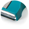 Close-up of the stainless steel julienne blade on the teal Monkey Business Karoto vegetable sharpener